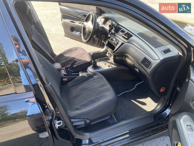 Чорний Міцубісі Lancer, об'ємом двигуна 1.58 л та пробігом 236 тис. км за 4500 $, фото 9 на Automoto.ua