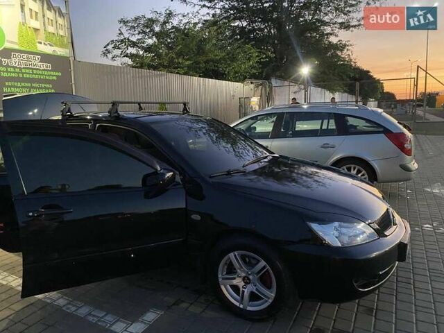 Черный Мицубиси Лансер, объемом двигателя 1.6 л и пробегом 257 тыс. км за 4500 $, фото 3 на Automoto.ua