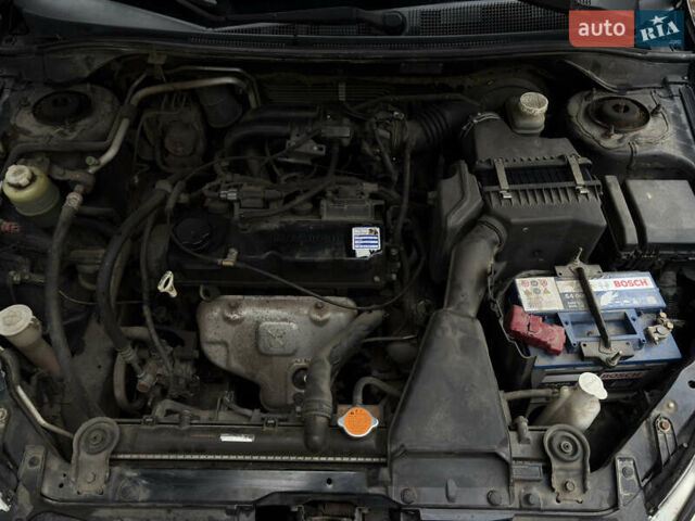 Чорний Міцубісі Lancer, об'ємом двигуна 1.58 л та пробігом 210 тис. км за 3900 $, фото 17 на Automoto.ua