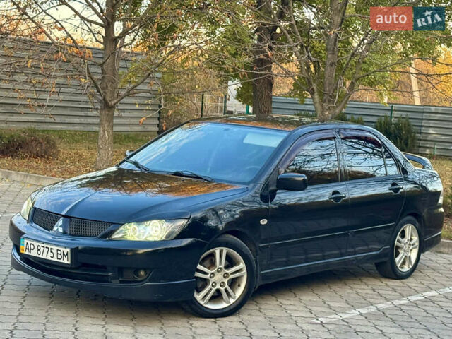 Міцубісі Lancer 2006 у Дніпро (Дніпропетровську) на Automoto.ua Чорний Міцубісі Lancer, об'ємом двигуна 2 л та пробігом 230 тис. км за 4900 $, фото 2 на Automoto.ua