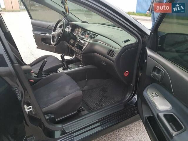 Чорний Міцубісі Lancer, об'ємом двигуна 1.58 л та пробігом 290 тис. км за 3200 $, фото 13 на Automoto.ua