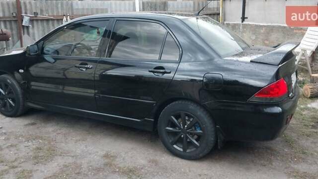 Чорний Міцубісі Lancer, об'ємом двигуна 1.59 л та пробігом 185 тис. км за 4900 $, фото 5 на Automoto.ua