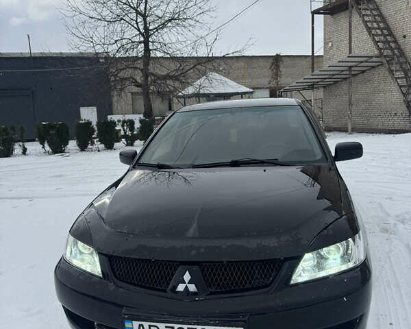 Чорний Міцубісі Lancer, об'ємом двигуна 1.58 л та пробігом 340 тис. км за 3550 $, фото 2 на Automoto.ua