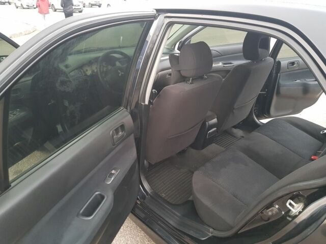 Черный Мицубиси Лансер, объемом двигателя 1.6 л и пробегом 290 тыс. км за 3200 $, фото 8 на Automoto.ua