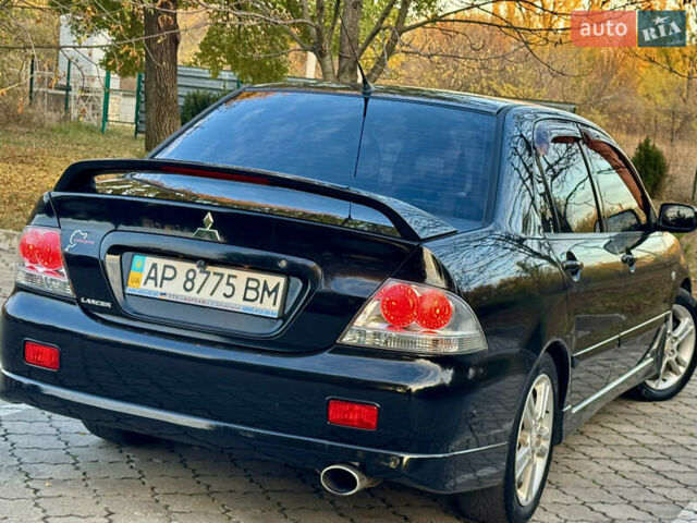 Міцубісі Lancer 2006 у Дніпро (Дніпропетровську) на Automoto.ua Чорний Міцубісі Lancer, об'ємом двигуна 2 л та пробігом 230 тис. км за 4900 $, фото 10 на Automoto.ua