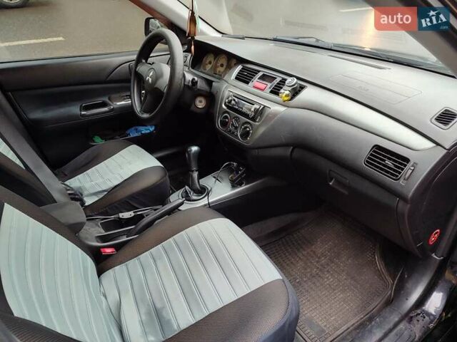 Черный Мицубиси Лансер, объемом двигателя 1.58 л и пробегом 270 тыс. км за 4000 $, фото 2 на Automoto.ua