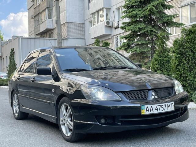 Чорний Міцубісі Lancer, об'ємом двигуна 2 л та пробігом 160 тис. км за 5000 $, фото 1 на Automoto.ua