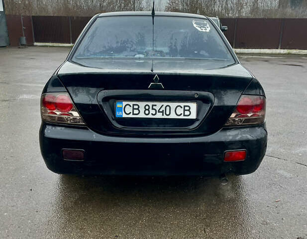 Чорний Міцубісі Lancer, об'ємом двигуна 1.59 л та пробігом 305 тис. км за 2950 $, фото 5 на Automoto.ua