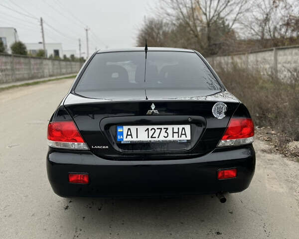 Чорний Міцубісі Lancer, об'ємом двигуна 1.58 л та пробігом 230 тис. км за 3350 $, фото 3 на Automoto.ua