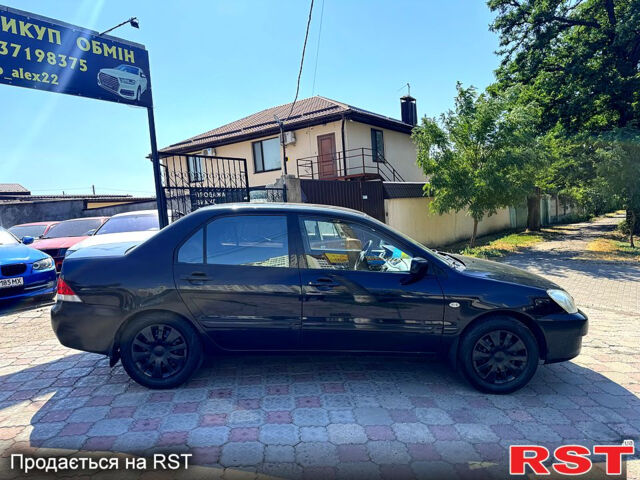 Черный Мицубиси Лансер, объемом двигателя 1.6 л и пробегом 300 тыс. км за 3599 $, фото 4 на Automoto.ua