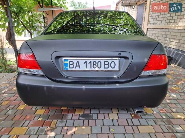 Чорний Міцубісі Lancer, об'ємом двигуна 1.58 л та пробігом 280 тис. км за 3950 $, фото 6 на Automoto.ua