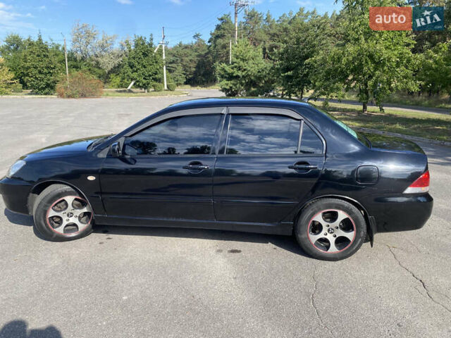 Чорний Міцубісі Lancer, об'ємом двигуна 1.58 л та пробігом 236 тис. км за 4500 $, фото 4 на Automoto.ua