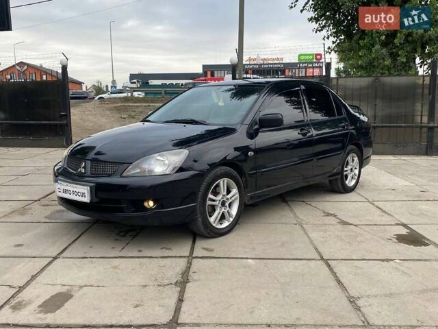 Чорний Міцубісі Lancer, об'ємом двигуна 2 л та пробігом 248 тис. км за 4990 $, фото 2 на Automoto.ua
