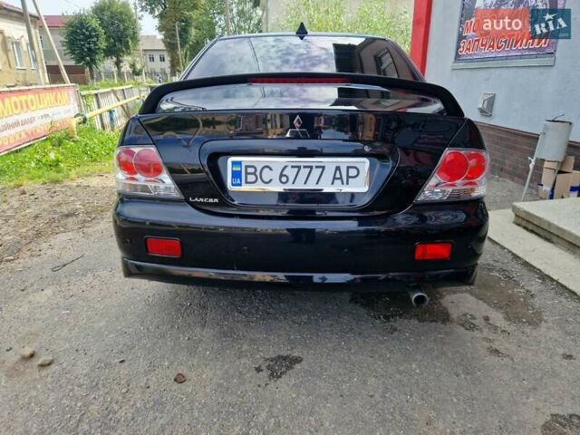 Черный Мицубиси Лансер, объемом двигателя 2 л и пробегом 168 тыс. км за 4999 $, фото 6 на Automoto.ua