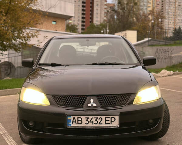 Чорний Міцубісі Lancer, об'ємом двигуна 1.58 л та пробігом 230 тис. км за 4350 $, фото 6 на Automoto.ua