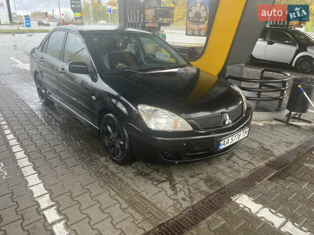 Чорний Міцубісі Lancer, об'ємом двигуна 1.58 л та пробігом 257 тис. км за 2400 $, фото 8 на Automoto.ua