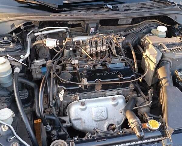 Чорний Міцубісі Lancer, об'ємом двигуна 1.6 л та пробігом 325 тис. км за 4750 $, фото 1 на Automoto.ua