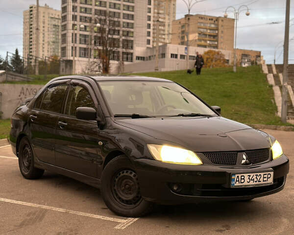 Чорний Міцубісі Lancer, об'ємом двигуна 1.58 л та пробігом 230 тис. км за 4350 $, фото 5 на Automoto.ua