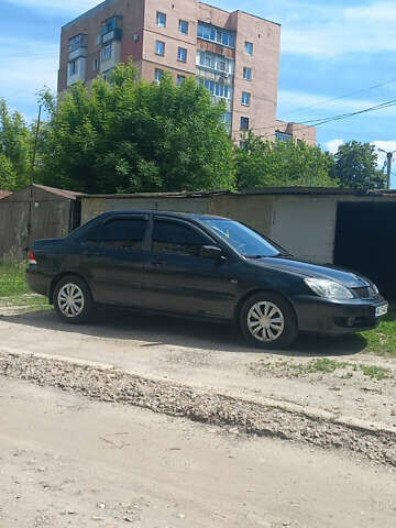 Чорний Міцубісі Lancer, об'ємом двигуна 1.58 л та пробігом 277 тис. км за 3900 $, фото 2 на Automoto.ua