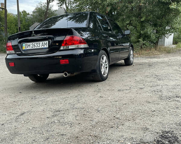 Чорний Міцубісі Lancer, об'ємом двигуна 1.6 л та пробігом 240 тис. км за 4599 $, фото 4 на Automoto.ua