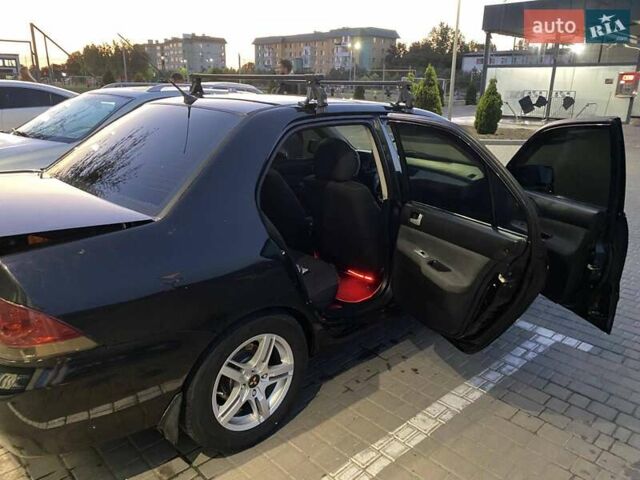 Черный Мицубиси Лансер, объемом двигателя 1.6 л и пробегом 257 тыс. км за 4500 $, фото 9 на Automoto.ua