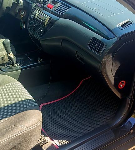 Черный Мицубиси Лансер, объемом двигателя 1.6 л и пробегом 238 тыс. км за 4300 $, фото 7 на Automoto.ua