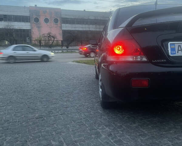 Черный Мицубиси Лансер, объемом двигателя 1.6 л и пробегом 231 тыс. км за 4250 $, фото 6 на Automoto.ua