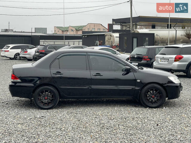 Чорний Міцубісі Lancer, об'ємом двигуна 1.58 л та пробігом 230 тис. км за 3350 $, фото 6 на Automoto.ua