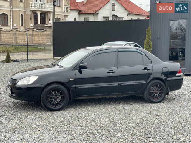Чорний Міцубісі Lancer, об'ємом двигуна 1.58 л та пробігом 230 тис. км за 3350 $, фото 13 на Automoto.ua