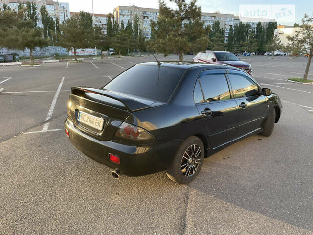 Чорний Міцубісі Lancer, об'ємом двигуна 2 л та пробігом 250 тис. км за 4999 $, фото 2 на Automoto.ua