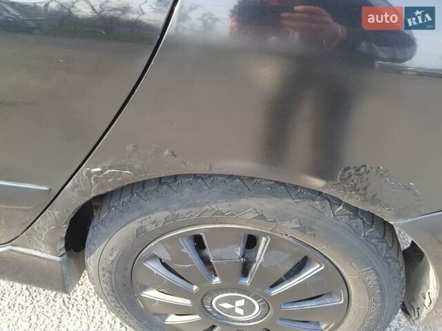 Чорний Міцубісі Lancer, об'ємом двигуна 1.58 л та пробігом 290 тис. км за 3200 $, фото 25 на Automoto.ua