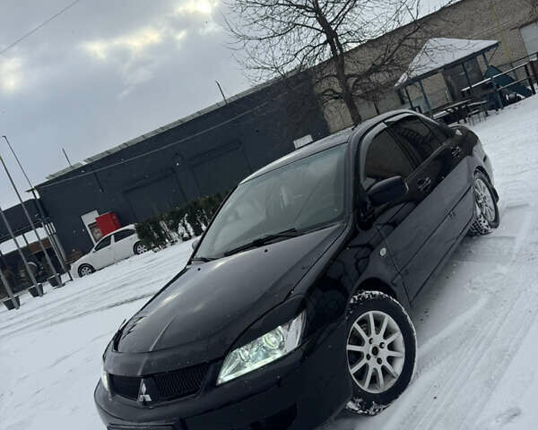 Чорний Міцубісі Lancer, об'ємом двигуна 1.58 л та пробігом 340 тис. км за 3550 $, фото 14 на Automoto.ua