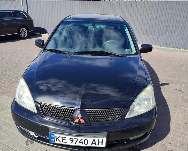 Чорний Міцубісі Lancer, об'ємом двигуна 1.58 л та пробігом 128 тис. км за 4600 $, фото 28 на Automoto.ua