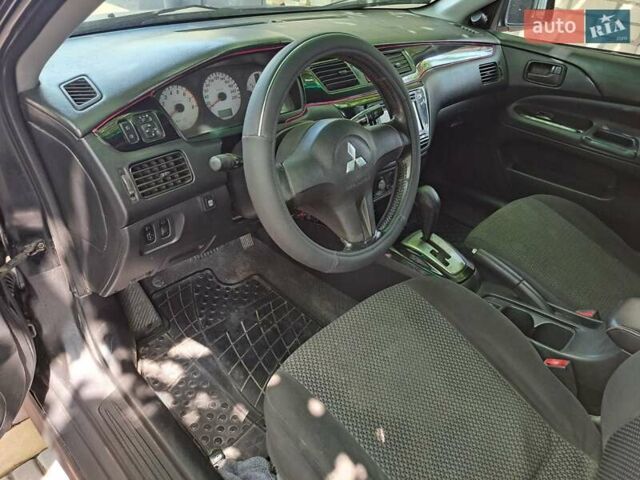Чорний Міцубісі Lancer, об'ємом двигуна 1.58 л та пробігом 280 тис. км за 3950 $, фото 12 на Automoto.ua