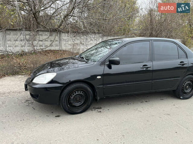 Чорний Міцубісі Lancer, об'ємом двигуна 1.58 л та пробігом 230 тис. км за 3350 $, фото 2 на Automoto.ua