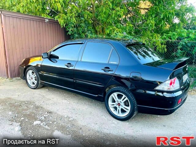 Чорний Міцубісі Lancer, об'ємом двигуна 2 л та пробігом 347 тис. км за 5200 $, фото 5 на Automoto.ua