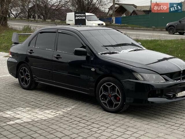 Черный Мицубиси Лансер, объемом двигателя 1.6 л и пробегом 200 тыс. км за 3200 $, фото 9 на Automoto.ua