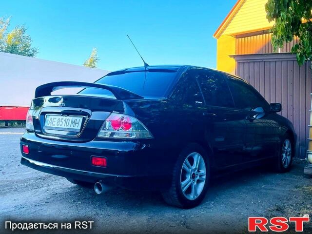 Чорний Міцубісі Lancer, об'ємом двигуна 2 л та пробігом 347 тис. км за 5200 $, фото 4 на Automoto.ua