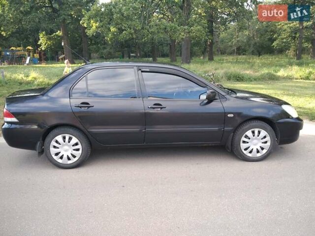 Чорний Міцубісі Lancer, об'ємом двигуна 1.58 л та пробігом 520 тис. км за 3400 $, фото 3 на Automoto.ua