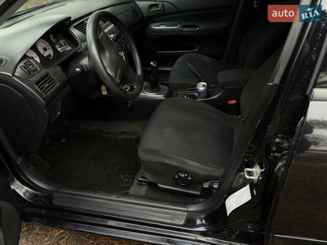 Чорний Міцубісі Lancer, об'ємом двигуна 1.58 л та пробігом 210 тис. км за 3900 $, фото 11 на Automoto.ua