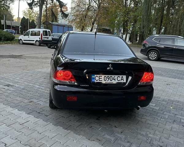 Черный Мицубиси Лансер, объемом двигателя 1.58 л и пробегом 230 тыс. км за 3800 $, фото 5 на Automoto.ua