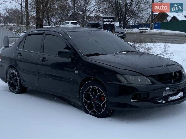 Черный Мицубиси Лансер, объемом двигателя 1.6 л и пробегом 200 тыс. км за 3200 $, фото 2 на Automoto.ua