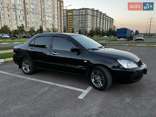 Чорний Міцубісі Lancer, об'ємом двигуна 1.58 л та пробігом 329 тис. км за 3500 $, фото 1 на Automoto.ua