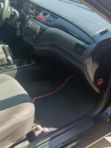 Чорний Міцубісі Lancer, об'ємом двигуна 1.6 л та пробігом 240 тис. км за 3900 $, фото 10 на Automoto.ua