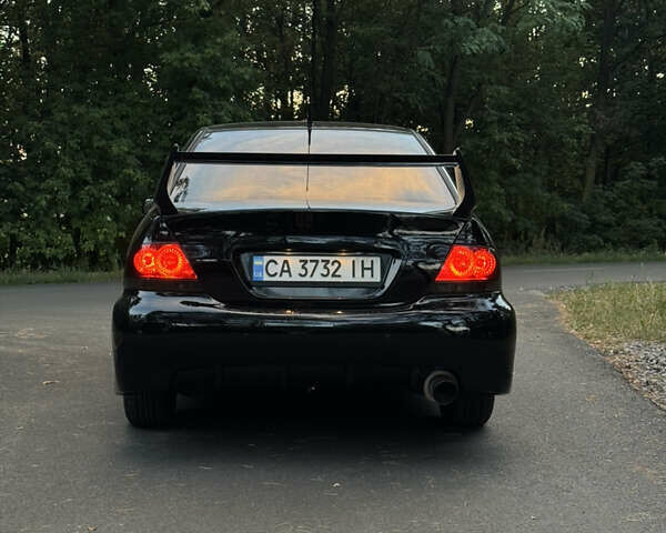 Чорний Міцубісі Lancer, об'ємом двигуна 1.6 л та пробігом 375 тис. км за 4500 $, фото 4 на Automoto.ua