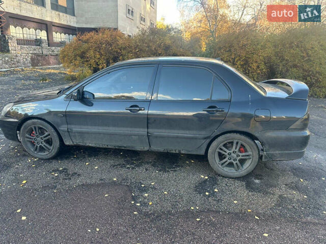Чорний Міцубісі Lancer, об'ємом двигуна 2 л та пробігом 270 тис. км за 3300 $, фото 3 на Automoto.ua