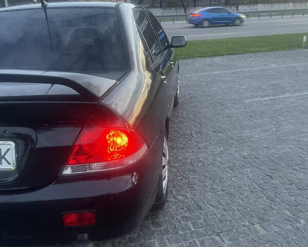 Черный Мицубиси Лансер, объемом двигателя 1.6 л и пробегом 231 тыс. км за 4250 $, фото 5 на Automoto.ua