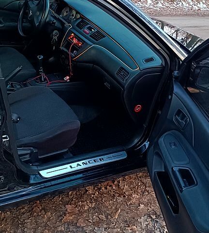 Чорний Міцубісі Lancer, об'ємом двигуна 1.6 л та пробігом 345 тис. км за 3700 $, фото 3 на Automoto.ua