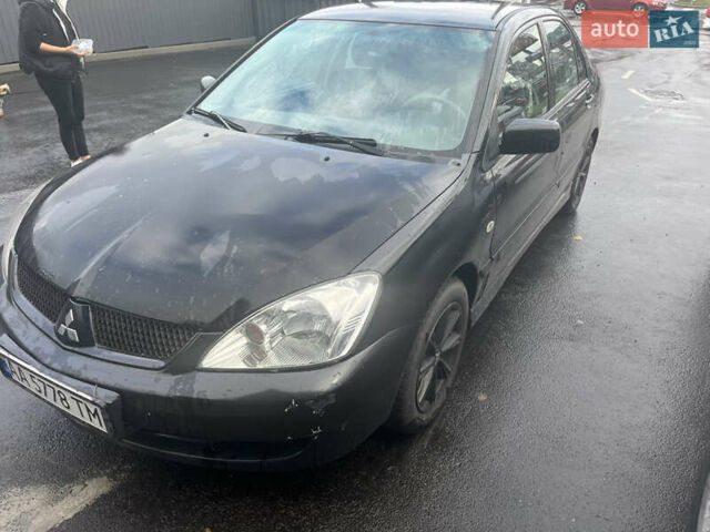 Чорний Міцубісі Lancer, об'ємом двигуна 1.58 л та пробігом 257 тис. км за 2400 $, фото 2 на Automoto.ua