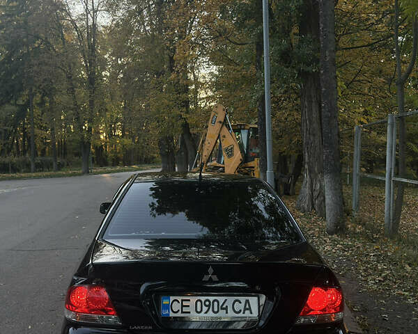 Черный Мицубиси Лансер, объемом двигателя 1.6 л и пробегом 233 тыс. км за 3650 $, фото 3 на Automoto.ua